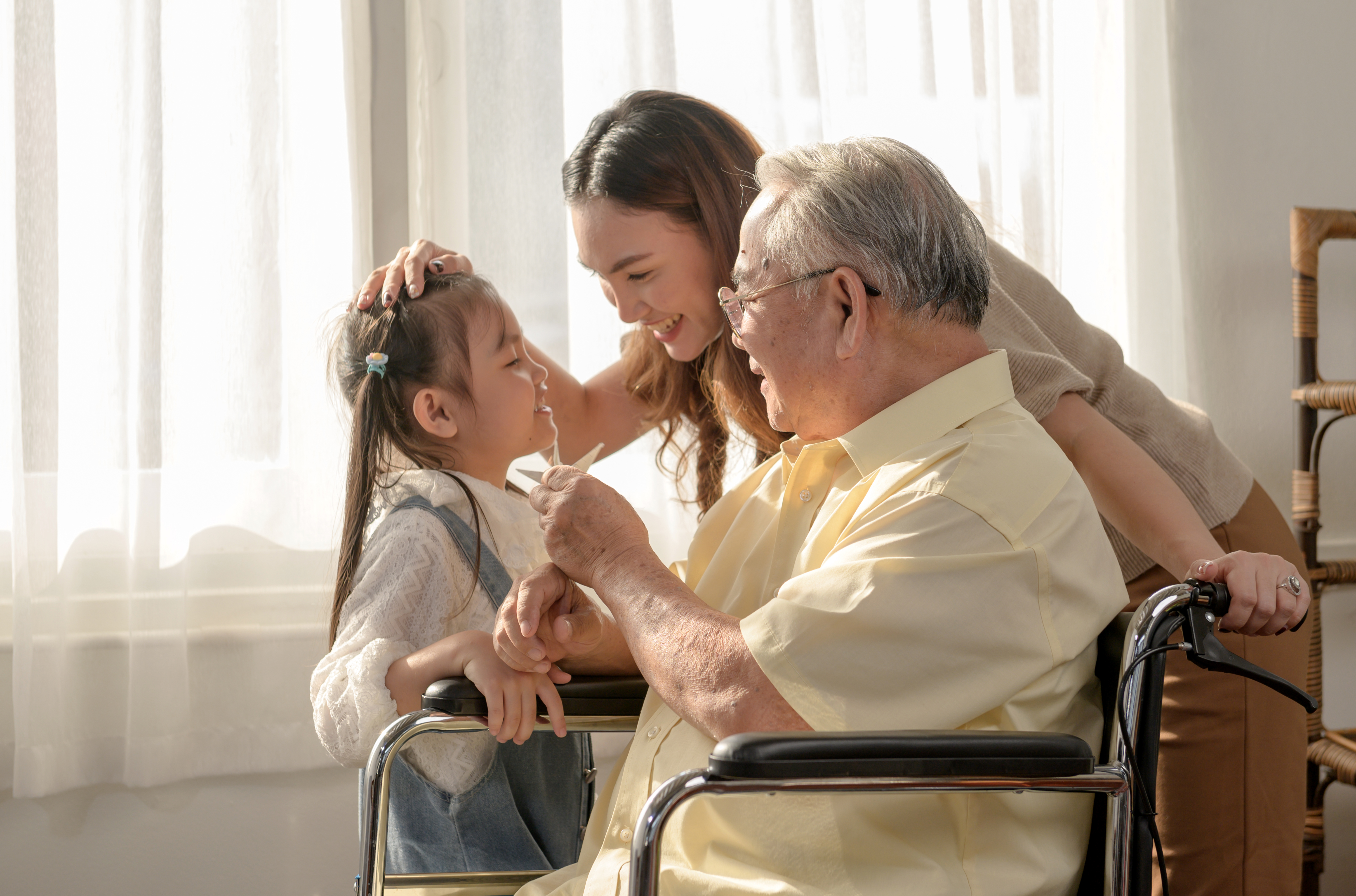 grandfather playing with his granddaughter